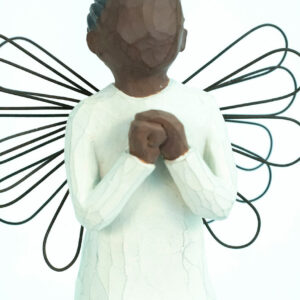 angel figurine with wire wings, praying hands, closeup