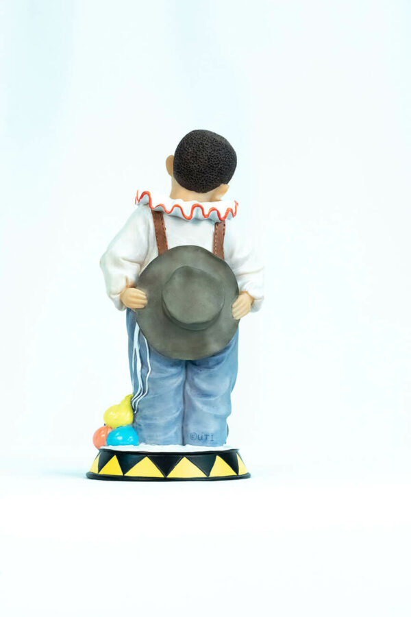 clown figurine, child clown in baggy blue pants, back