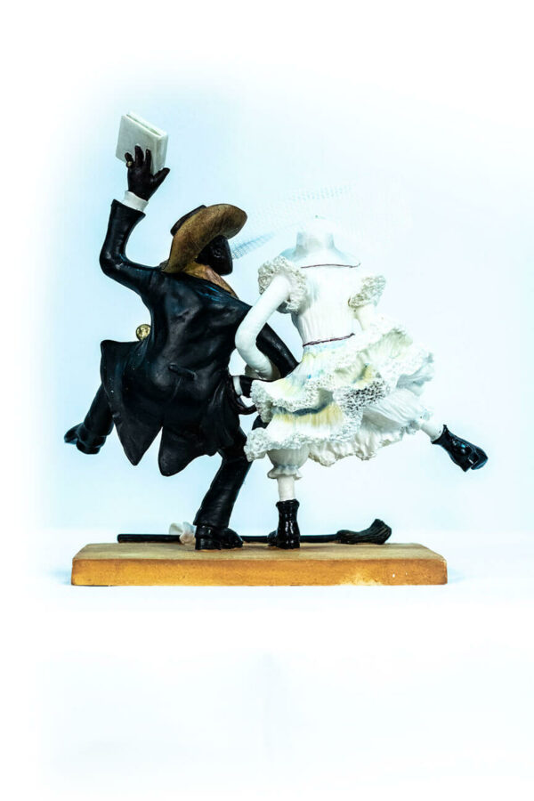 wedding couple figurine, couple jumping broom, back