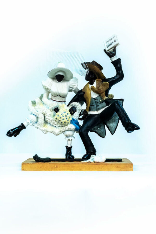 wedding couple figurine, couple jumping broom, front