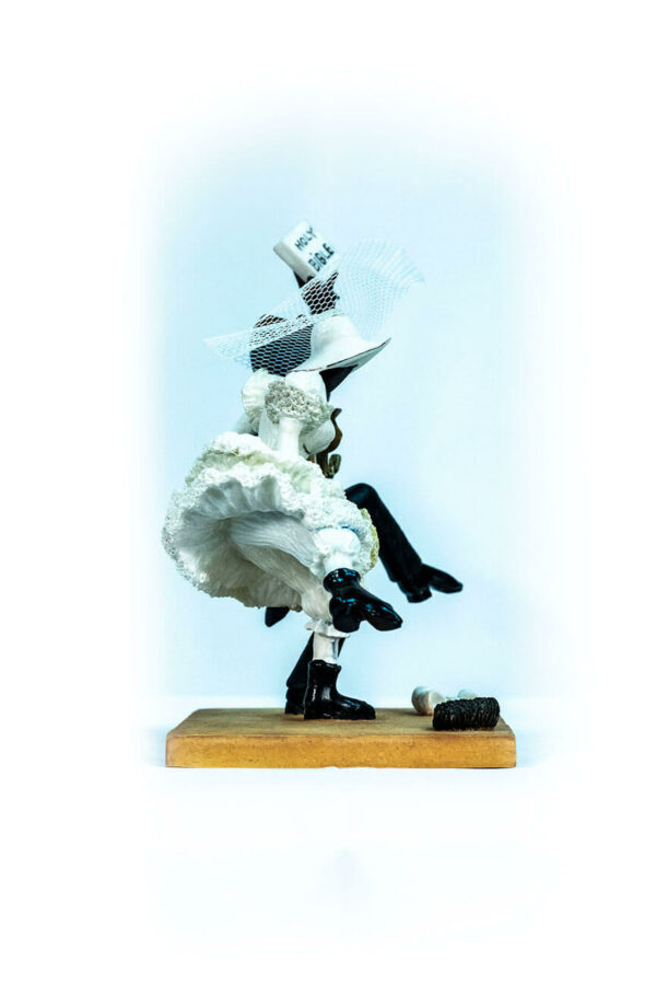 wedding couple figurine, couple jumping broom, right