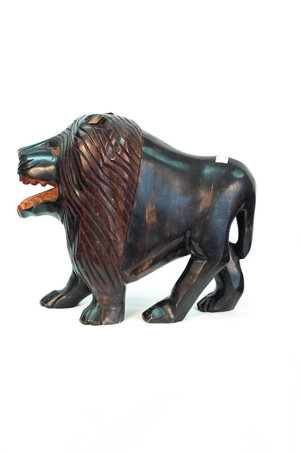 wood carving of lion, left