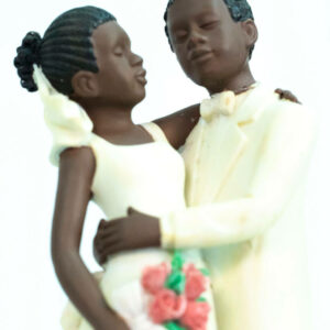 wedding couple figurine, dancing bride and groom in white, closeup