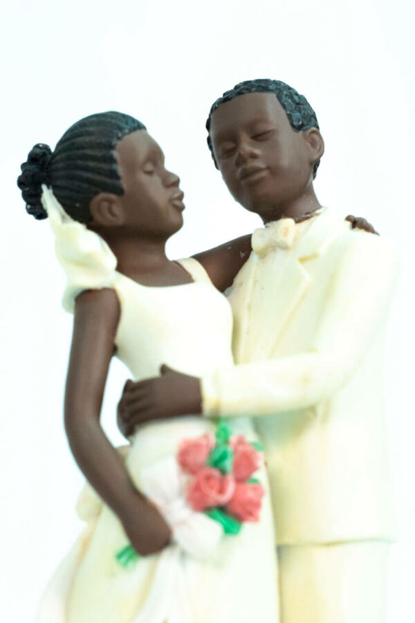 wedding couple figurine, dancing bride and groom in white, closeup