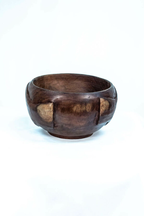 wooden bowl with hands carved on the sides, back