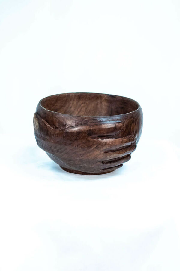 wooden bowl with hands carved on the sides, right